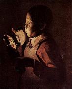 Georges de La Tour Knabe blast in eine Lampe oil on canvas